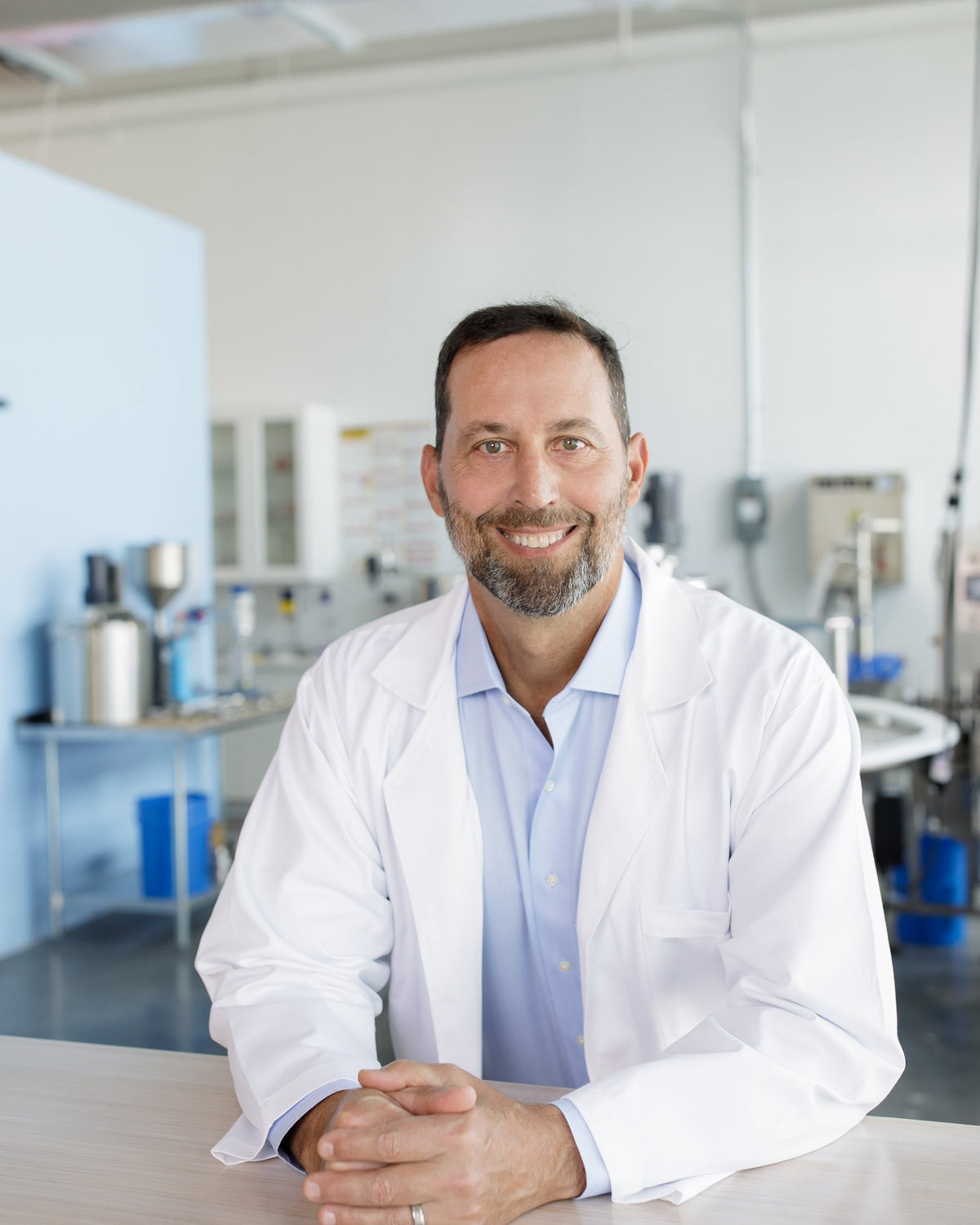 Dr. Rod Garcia in a white coat, in the lab.