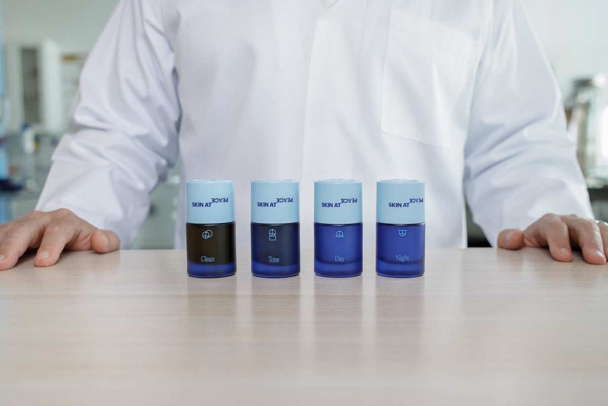 The four bottles in a row on the lab counter, Dr. Rod behind them.